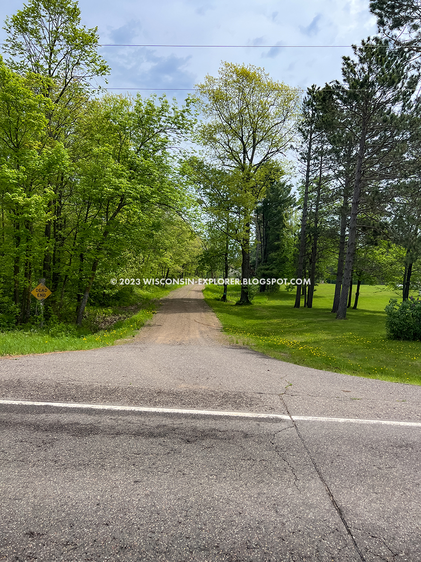 tree lined gravel road