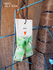 a piece of 2x4, some ribbon and a dab of paint makes the cutest little snowman ornament!