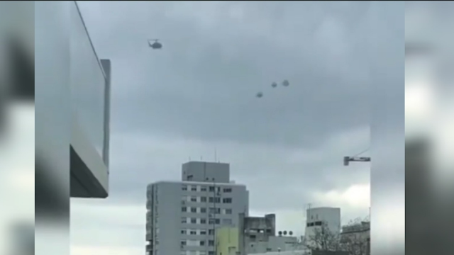 Here's the best screenshot of the 3 UFOs and helicopter over a Japanese city.