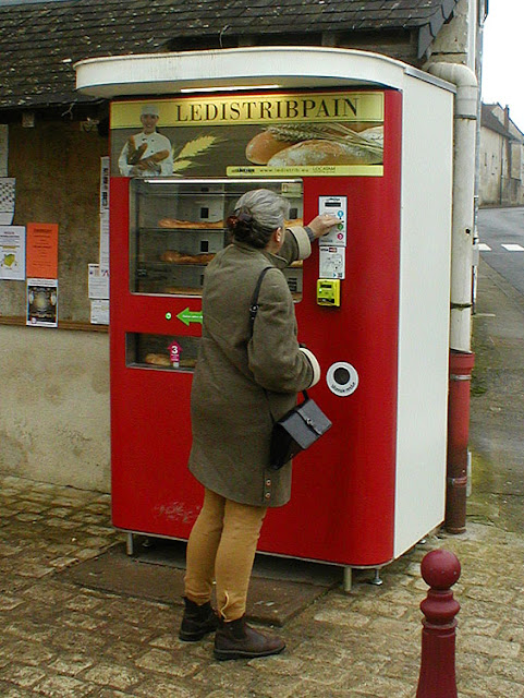 Buying a baguette from a vending machine, Indre et Loire, France. Photo by Loire Valley Time Travel.