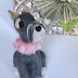 A polymer clay hand sculpted OOAK miniature Schnauzer