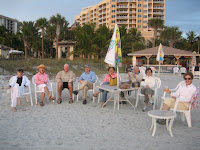 Sarasota real estate owners and customer on beach at Lido Key