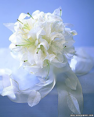 This bouquet is perfect for a winter wedding Casablanca lilies some a 