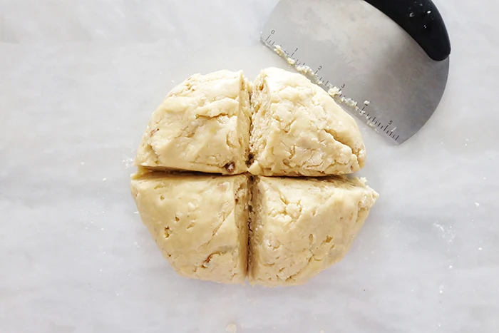 dough ball sliced in four pieces