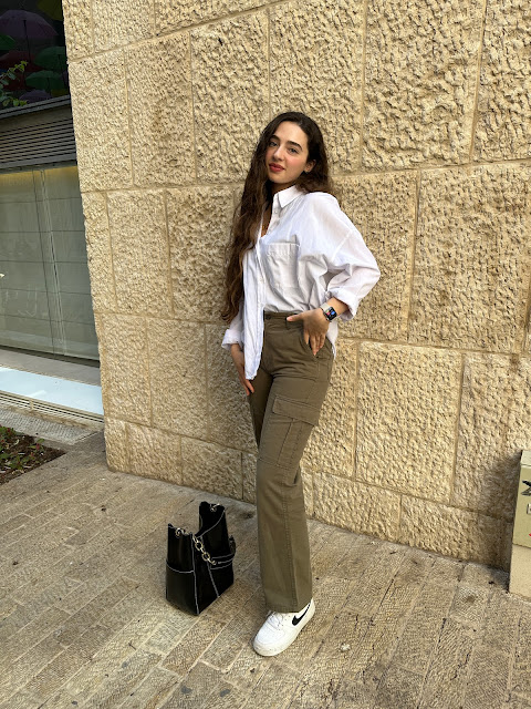 woman in cargo pants and white button down