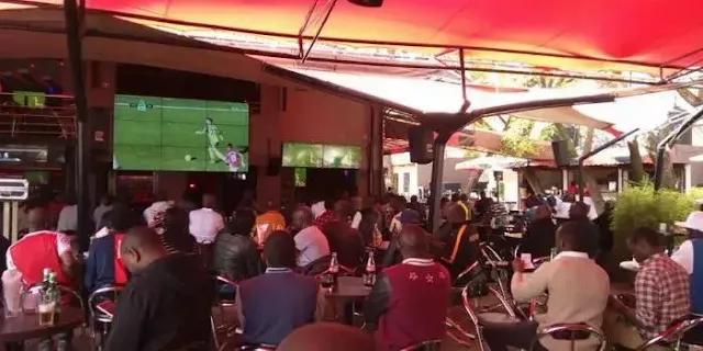 People watching football in a club in Nairobi photo