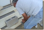 second gate 060111_jimmy cutting wood with cinder block in place 6-1-2011 9-59-07 AM 605x403