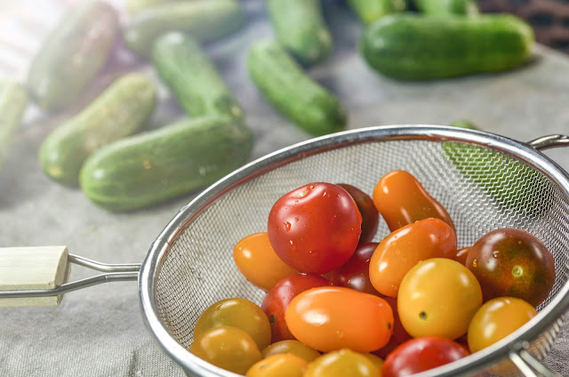 strainer with cherry tomatoes