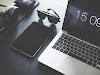 Black Sunglasses Near Macbook Pro and Ipad