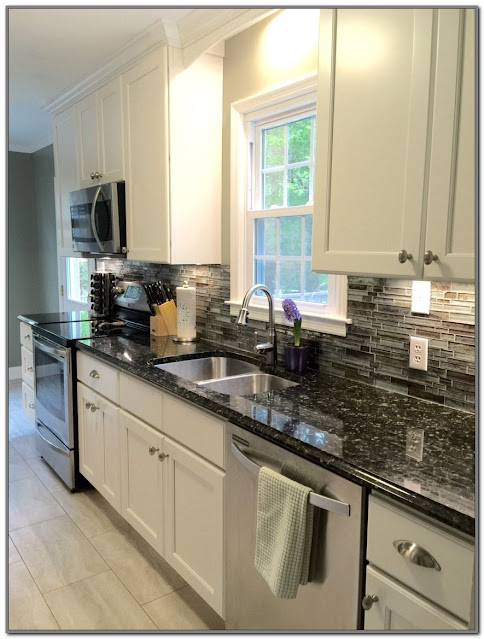 black kitchen cabinets with white countertops