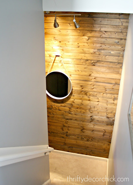 Planked wood wall on stairs