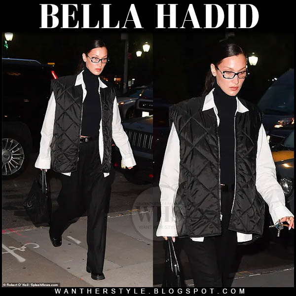 Bella Hadid in black quilted vest, white shirt and black trousers
