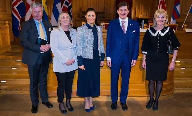 Crown Princess Victoria wore a tweed jacket from Mayla, and a navy silk blouse and navy pleated skirt from H&M