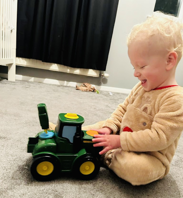 The Tomy Jon Deere Kids Key 'n Go Johnny Tractor