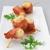 Scallops skewered with prosciutto