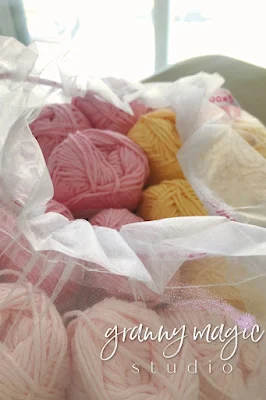 Shades of pink and yellow yarn.