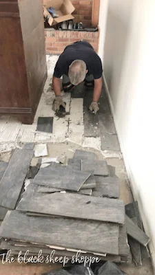 Removing tile floor.