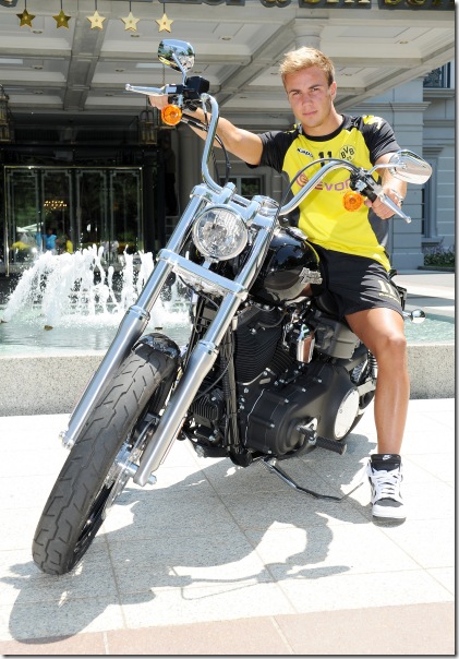 Dienstag 12.07.2011, 1. Bundesliga Saison 11/12 - BV Borussia Dortmund im Trainingslager in Bad Ragaz / Schweiz,  <br />Mario Goetze (BVB) auf einem Harley - Davidson Motorrad vor dem Grand Hotel Quellehof <br /><br />Foto: DeFodi.de +++ Copyright Vermerk DeFodi.de -- DeFodi Ltd. & Co. KG, Wellinghofer Str. 117, D- 44263 D o r t m u n d, sport@defodi.de, Tel 0231-700 500 44, Fax 0231-700 54 90, C o m m e r z b a n k  D o r t m u n d, Kto: 36 11 76 100, BLZ: 440 400 37 // BIC COBADEFF440 // IBAN: DE74 4404 0037 0361 1761 00 // Steuer-Nr.: 315/5803/1864 , USt-IdNr.: DE814907547 - 7% MwSt.