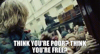 A gif of a scene from the film "Les Miserables" wherein the lyrics "Think you're poor? Think you're free?" are sung by the character Gavroche