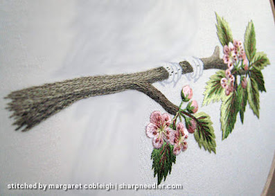 Robin on Blossom Branch (by Tanja Berlin): Detail of thread painted branch and foliage