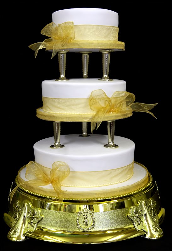 Next are two beautiful whote round three tier wedding cakes separated by