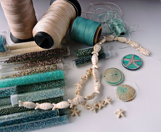 Turquoise, teal and ecru color palette with beads and cord.