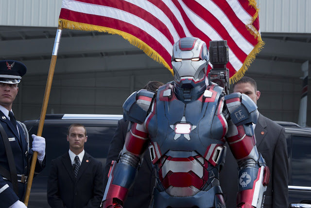 War Machine, his armor now painted in an American flag motif, similar to Captain America's uniform.