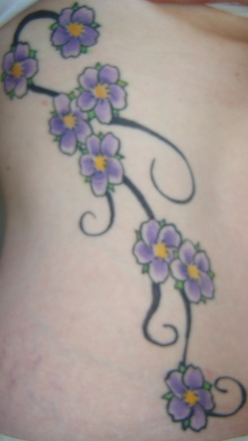 and beautiful delicate flower tattoo is the cherry blossom tattoos.