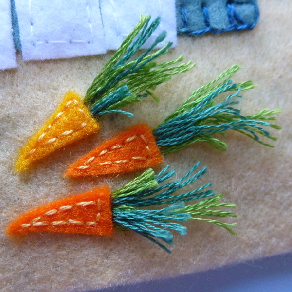 Wool blend felt orange carrots with green embroidery floss tops
