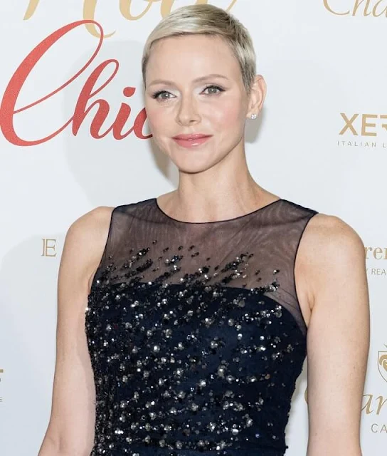 Princess Charlene wore a new sequined sleeveless tulle gown by Carolina Herrera. Christmas Ball 2022