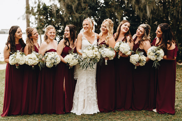 Bridal party in long maroon dresses