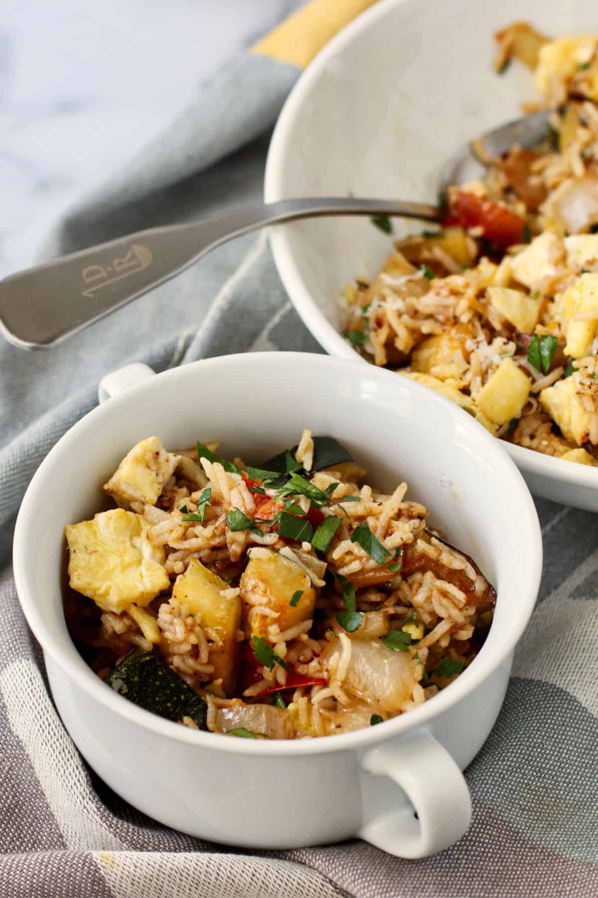 Zucchini Fried Rice in a small white bowl.