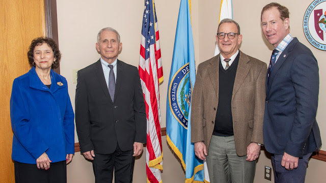 Dr. Anthony Fauci (left center) poses with USU dean Dr. Carol Romano, acting President Dr. William Roberts, and dean Dr. Eric Elster before delivering the annual David Packard Lecture, Apr. 11, 2022. (Photo credit: Tom Balfour, USU)
