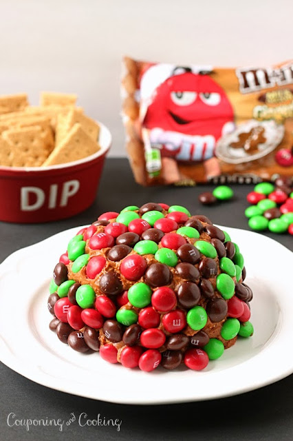 A gingerbread twist on a traditional dessert cheeseball, topped with Gingerbread M&M's it's the perfect holiday dessert! www.CouponingNCooking.com