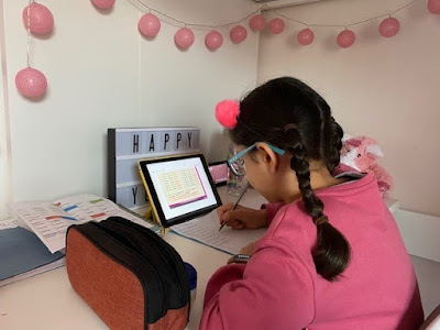 Child learning from home in bedroom