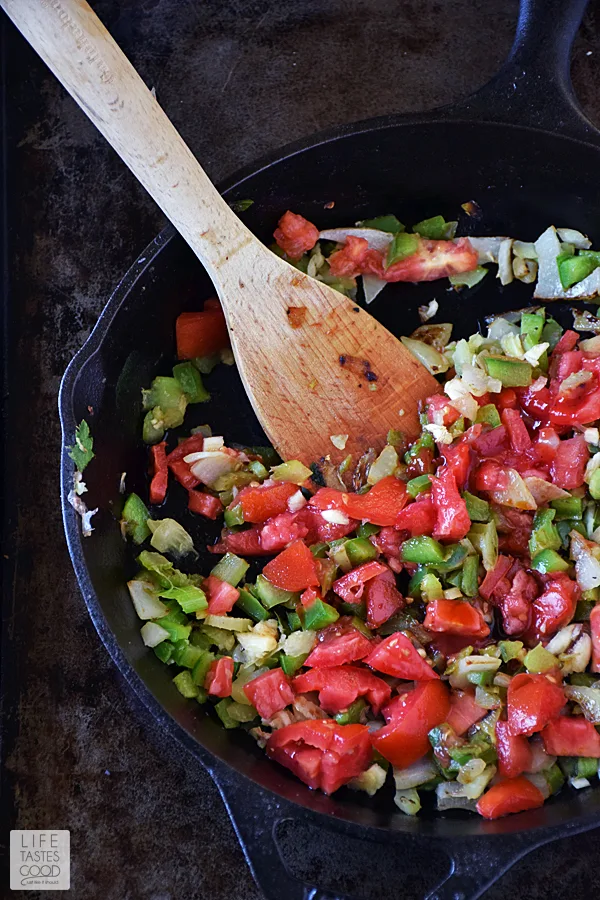 Added freshly chopped tomatoes to the vegetable saute while making this Mardi Gras appetizer - Skillet Jambalaya Dip