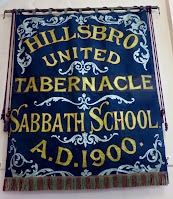 A Sabbath School banner from 1900, rescued from the building when it was destroyed in the Sheffield Blitz, and now hanging in the church