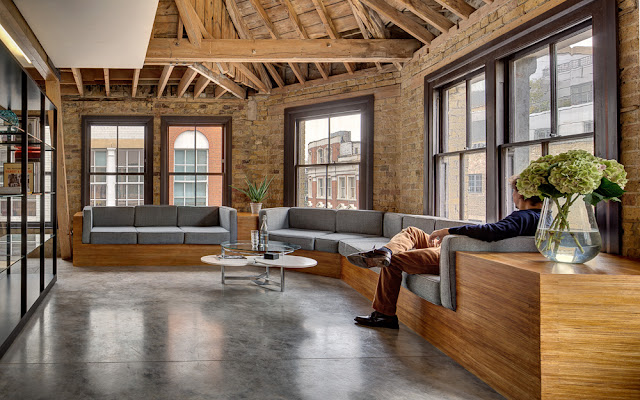 Picture of person sitting on the wooden furniture in the sitting area