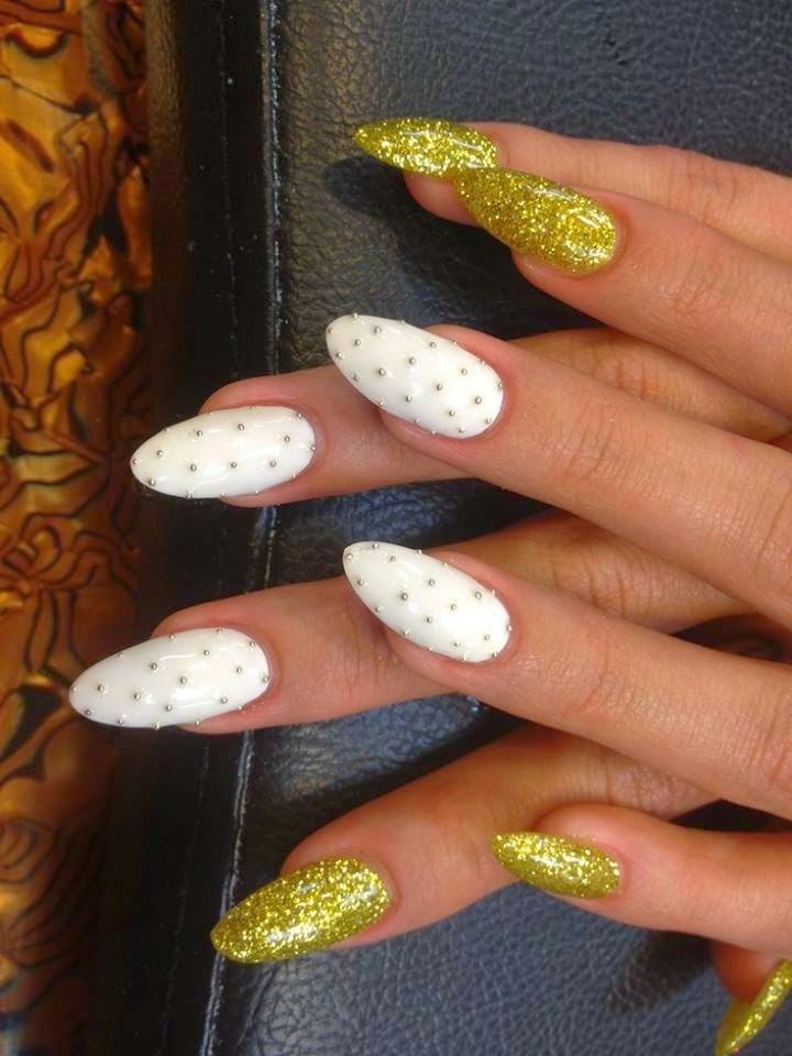 Acrylic almond sculpts + LED polish manicure.. custom mix glitz and the feats are silver studs
