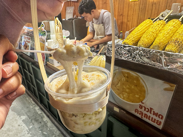 cheesy Thai street corn from a market in Bangkok, Thailand