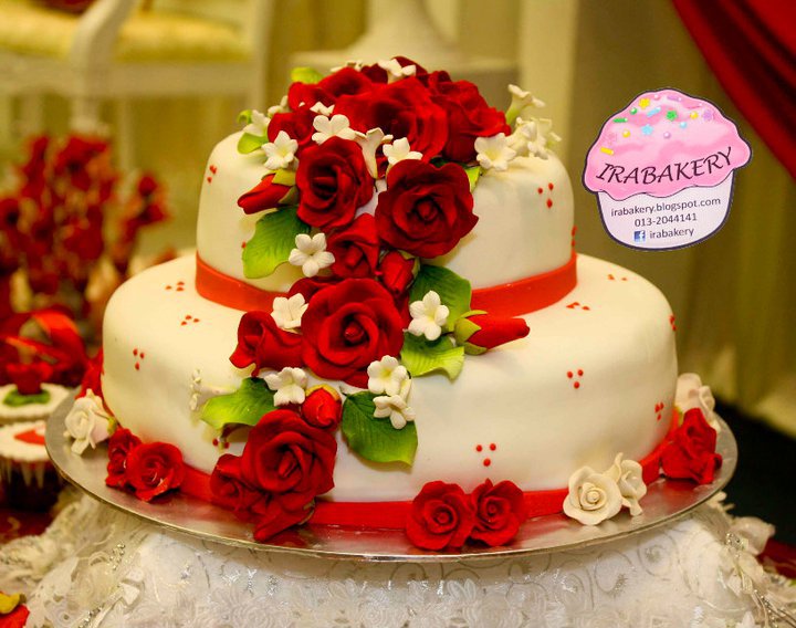 Fully fondant wedding cake with white and red theme complimented with set 