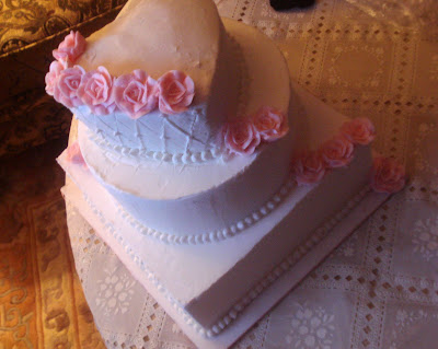 This is a sample wedding cake with two designs in one cake one side has the