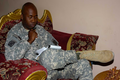 Soldier writes music to relax at MWR facility in Iraq (Photo by Spc. Katrina Faulkner-Brown)