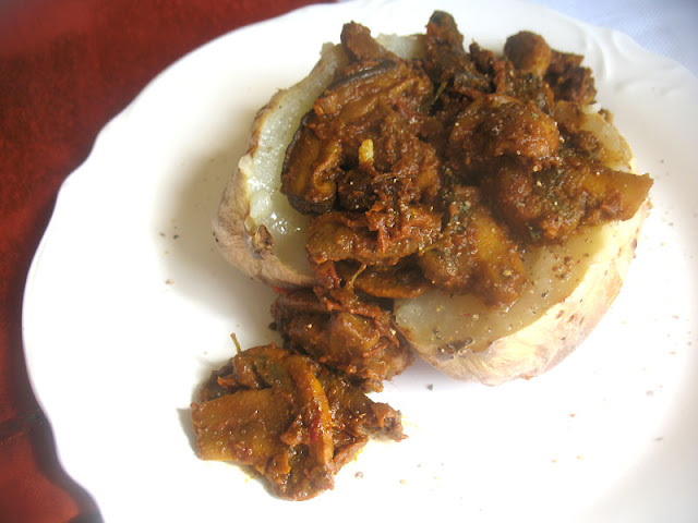 Spicy Mushroom Curry served over a Baked Potato