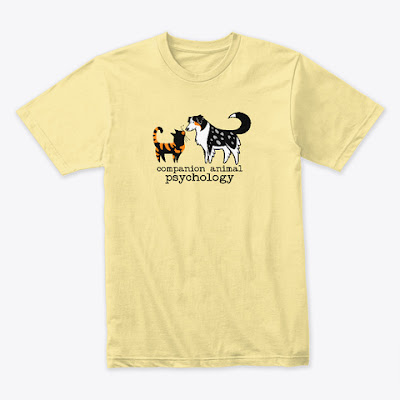 A yellow tee with the Companion Animal Psychology logo