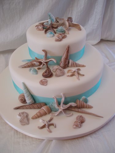 Beautiful beach wedding theme Seashell wedding cakes pictures with lots of 