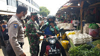 Kodim 0410/KBL Bersama Gugus Tugas Covir-19 Melaksanakan Penegakan Disiplin Protokol Kesehatan di Pasar Pasir Gintung