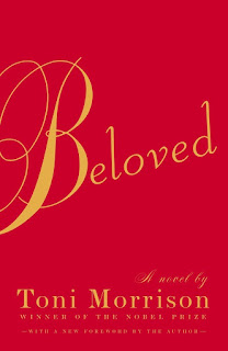 "Beloved" in cursive writing on a plain red background.