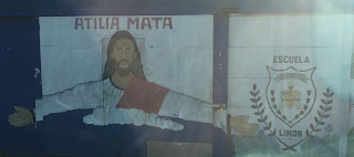 We are teaching at the Atilia Mata public school in Limon, a few blocks from the orphanage. The school sign has a picture of Jesus Christ below the school name.