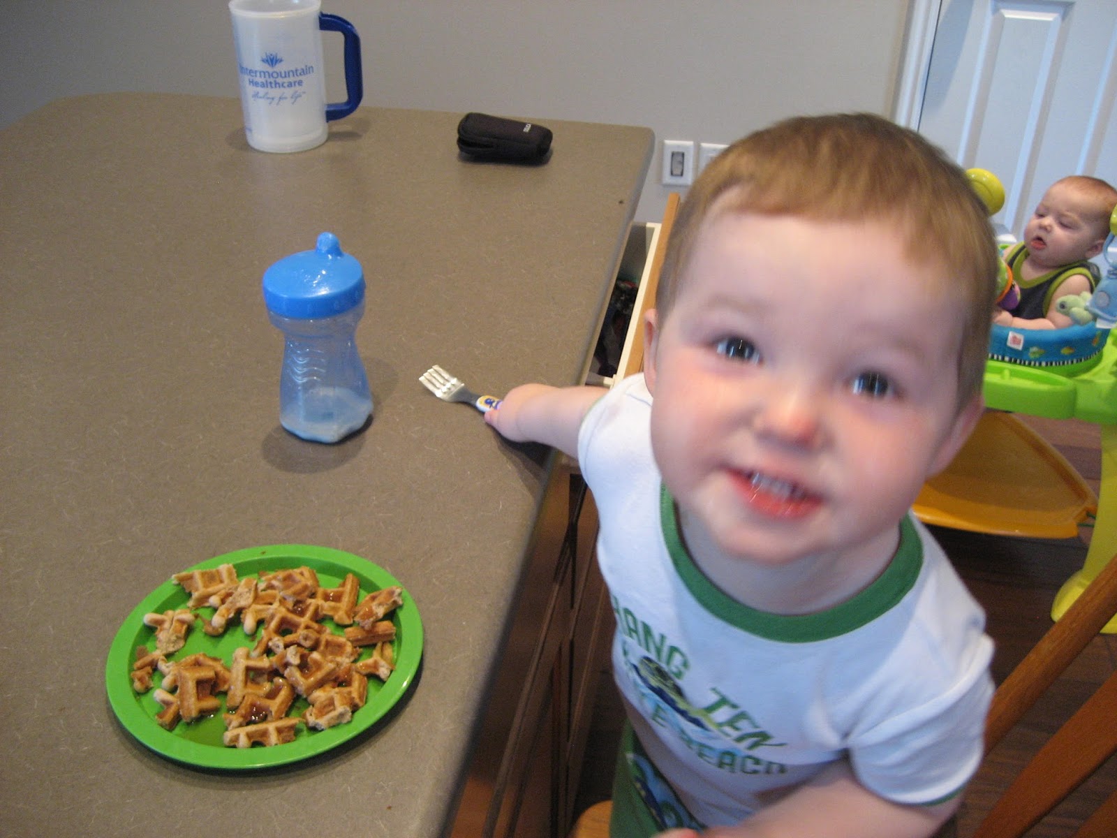 Dinner in the Life of a Dad—Coconut Flour Waffles. another picture of my son smiling while eating the waffles